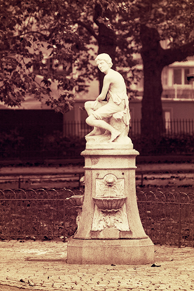 A stone drinking fountain statue opposite Queen Anne’s Gate