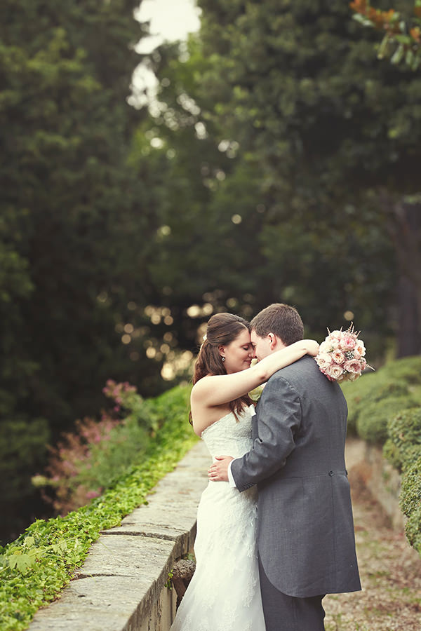 The bride and groom hugging
