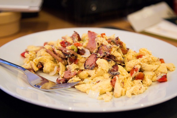 Scrambled eggs with bacon, peppers, and green onion