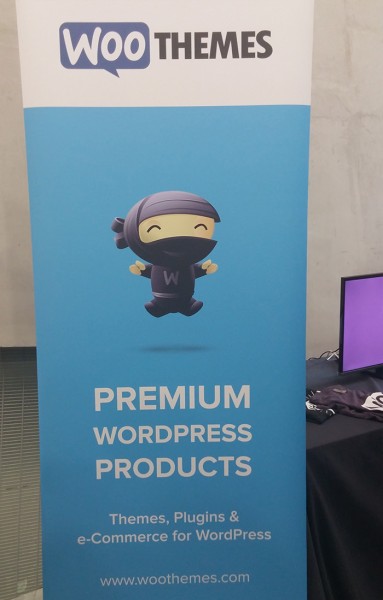 A WooThemes banner at WordCamp London