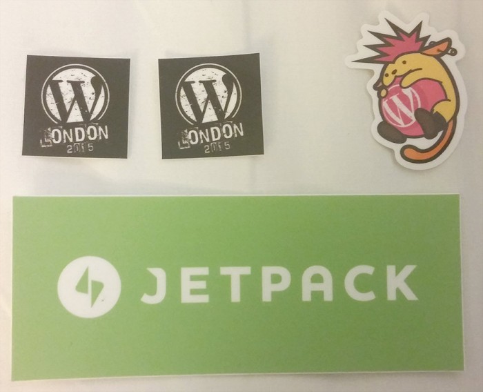 Stickers and swag from WordCamp London, including a Jetpack sticker