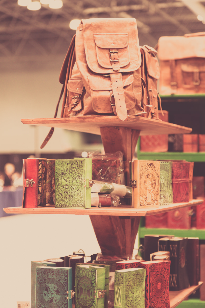 Leather bags and journals on a shelf