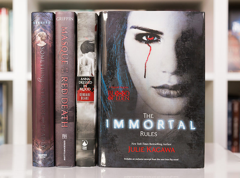 The Immortal Rules next to Something Strange and Deadly, Masque of the Red Death, and Anna Dressed in Blood