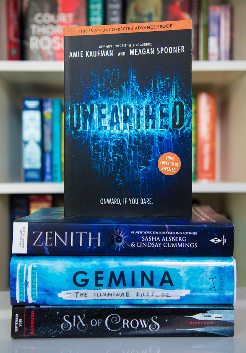 Advanced reading copy of Unearthed by Ami Kaufman and Meagan Spooner