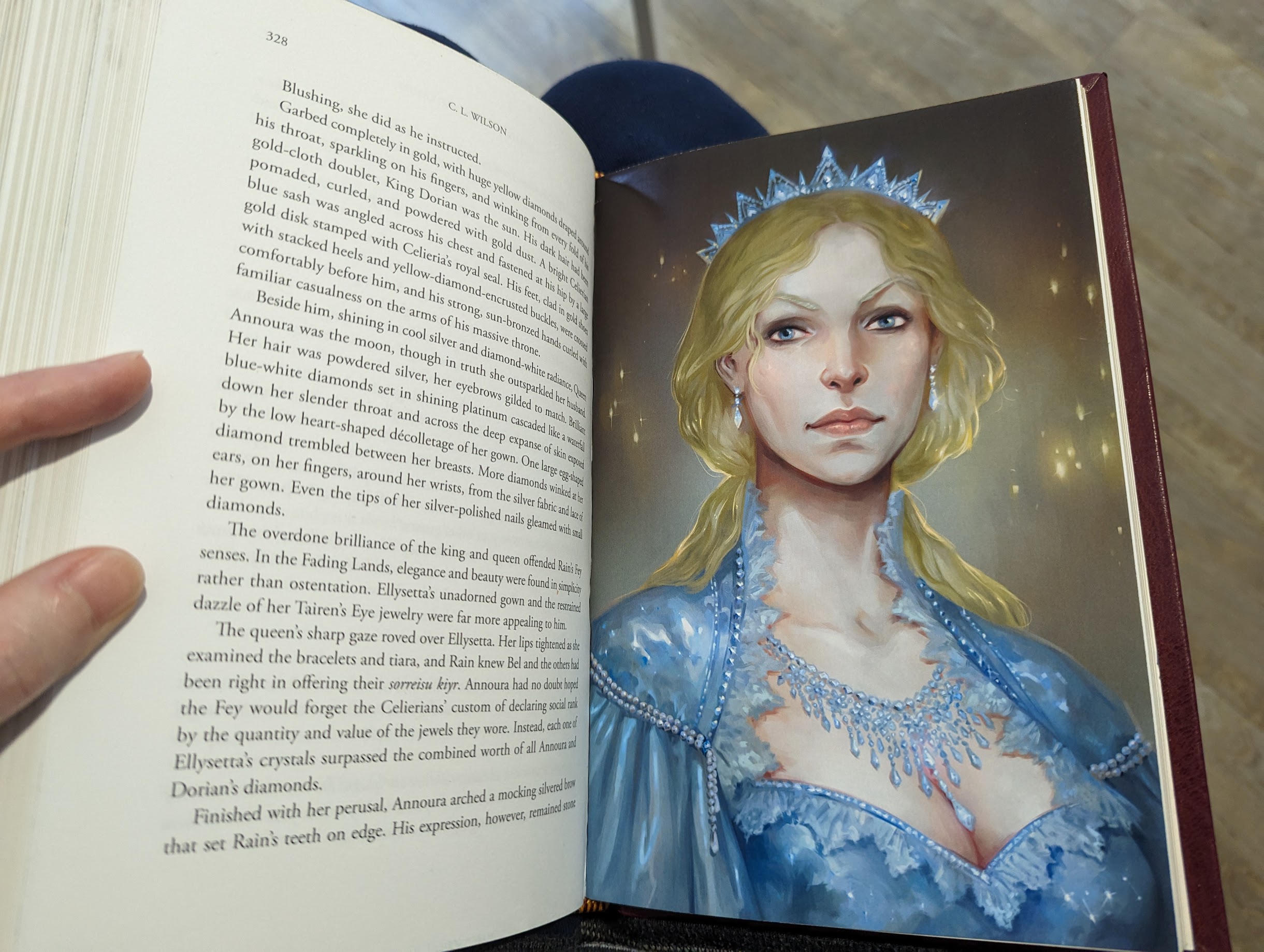 Photo of a full colour illustration inside a book, featuring queen Annoura from Tairen Soul