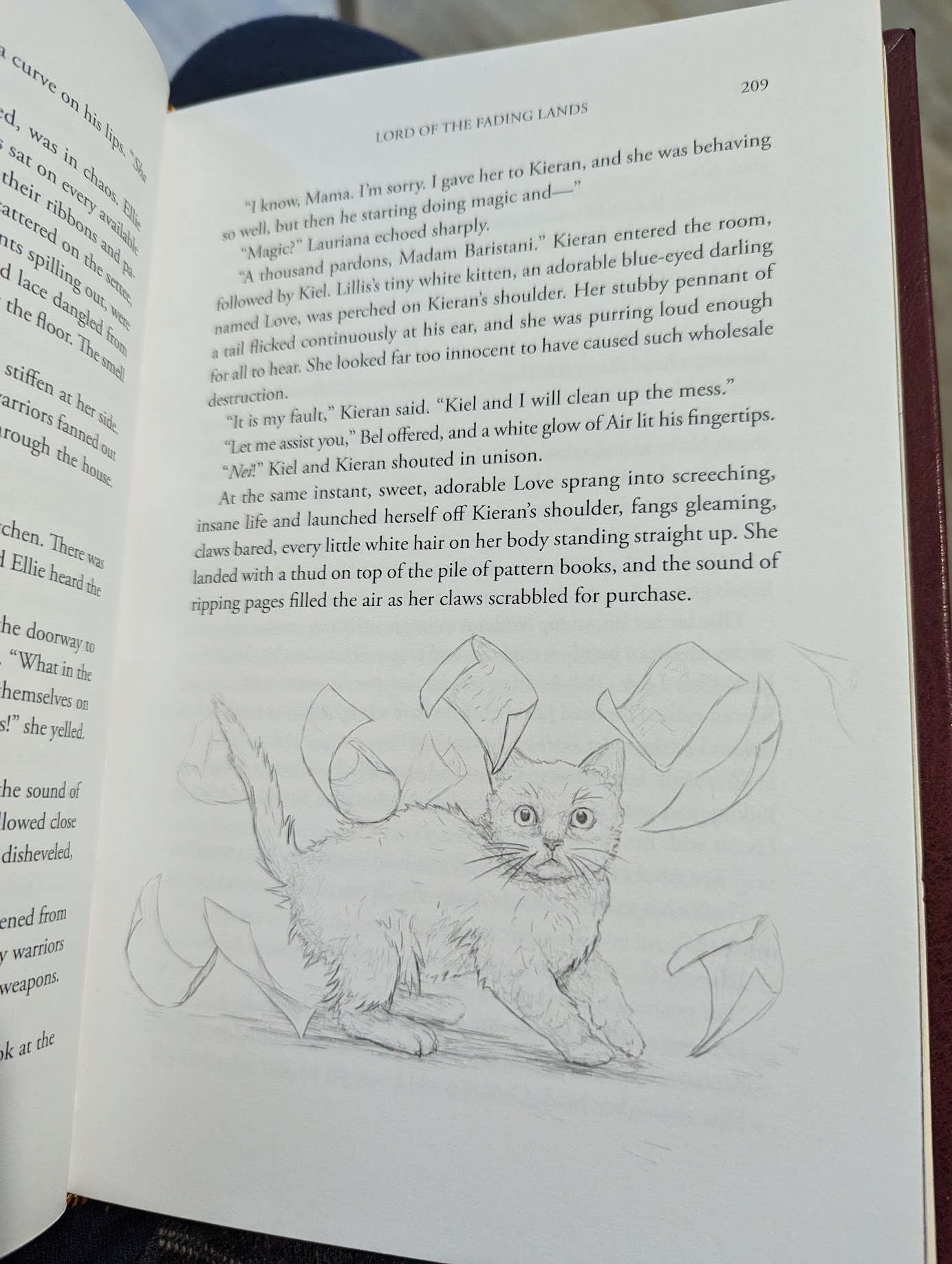 Photo of the interior page of a book. At the end of the page is a rough  sketch of a cat looking alarmed. There are papers flying all around it, as if the cat had just disrupted them in their fright.