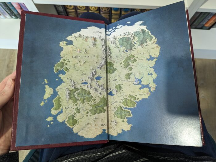 Photo of the endpapers on a book. The endpapers feature a full colour map illustration by New Horizons.