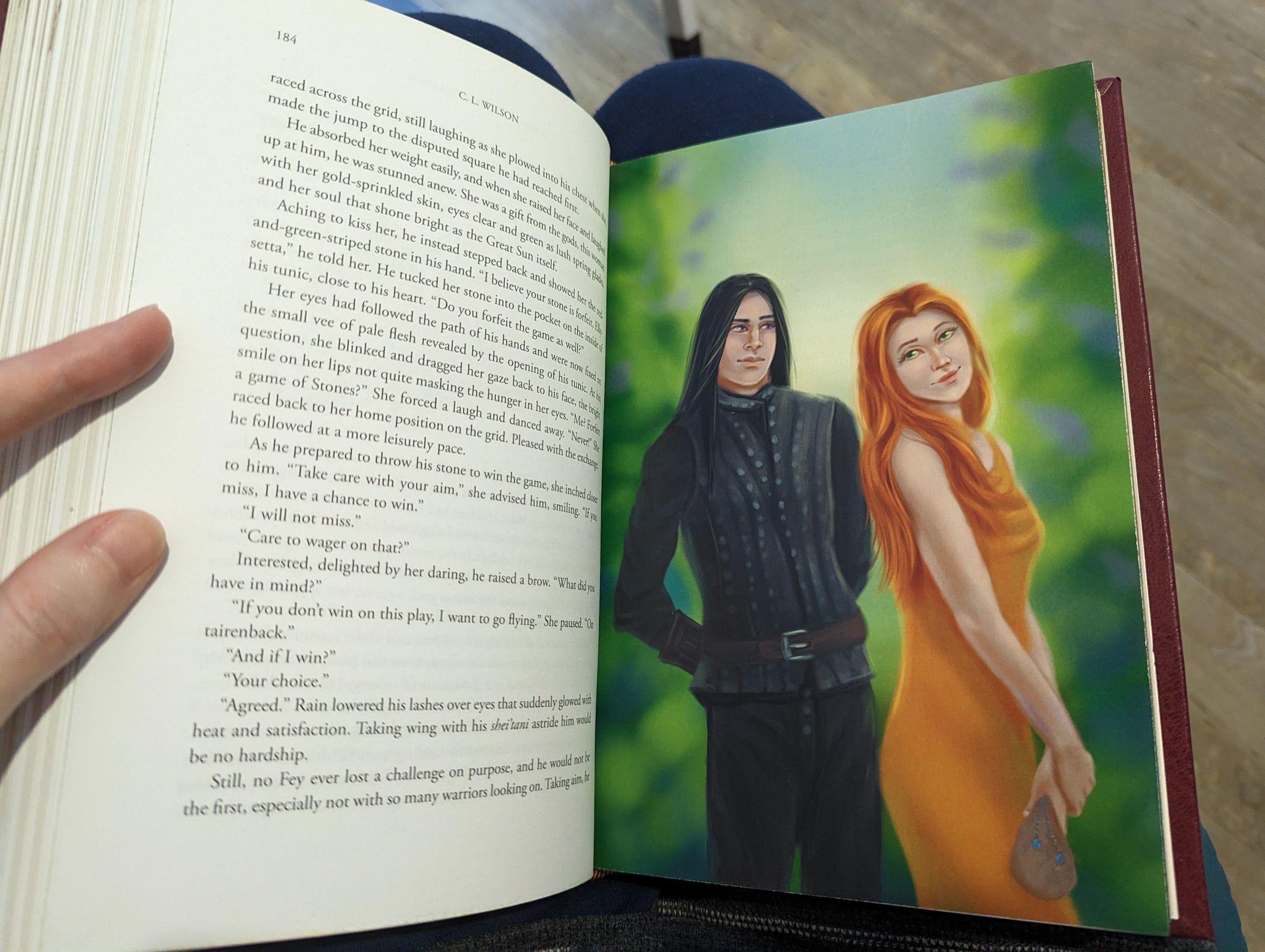 Photo of the interior of a book. On the left hand side is the text from the book. On the right is a full colour illustration of a man and woman. The woman has her back to the man, but her head tilted back a bit, as if she's teasing him. She's holding a small leather pouch in her hand. The man sort of looks like he's playfully rolling his eyes at her.